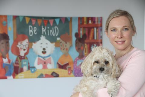 Photo of author Cara Zelas and her dog, Little Dude