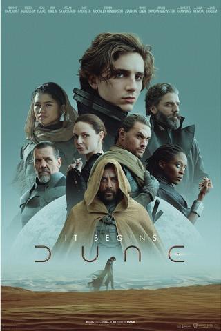 Several characters from the movie Dune in front of a sandy desert