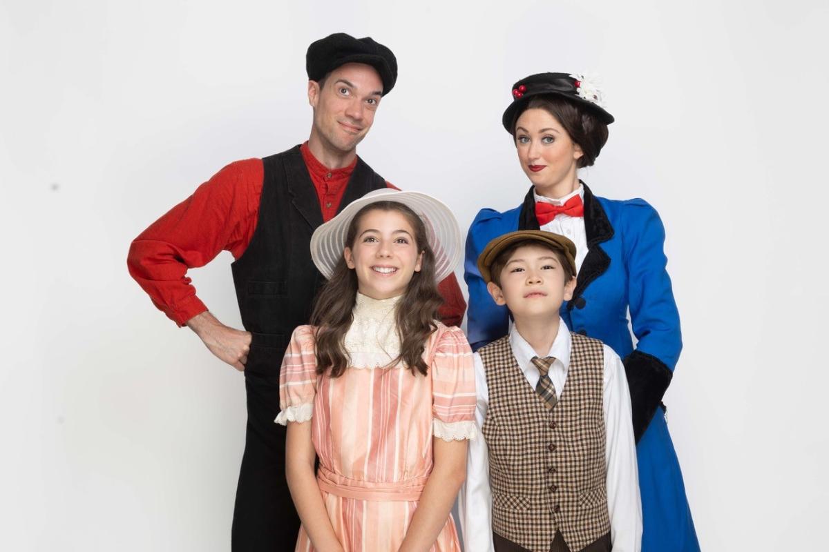 Four People dressed as Mary Poppins characters 